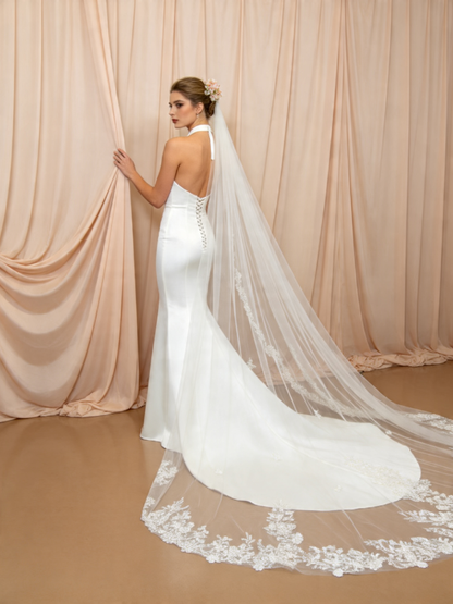 Bridal photoshoot with scattered floral lace cathedral veil, romantic wedding portrait