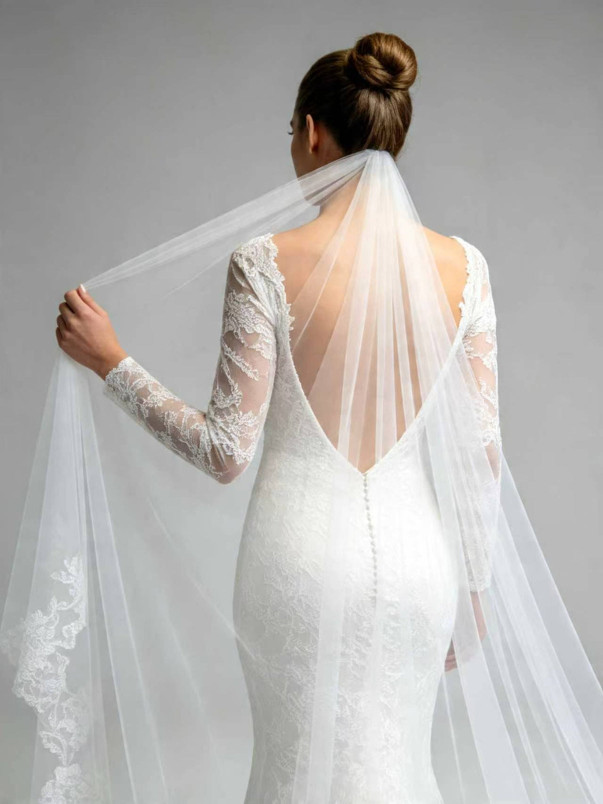Close-up of built-in comb on scattered floral cathedral wedding veil