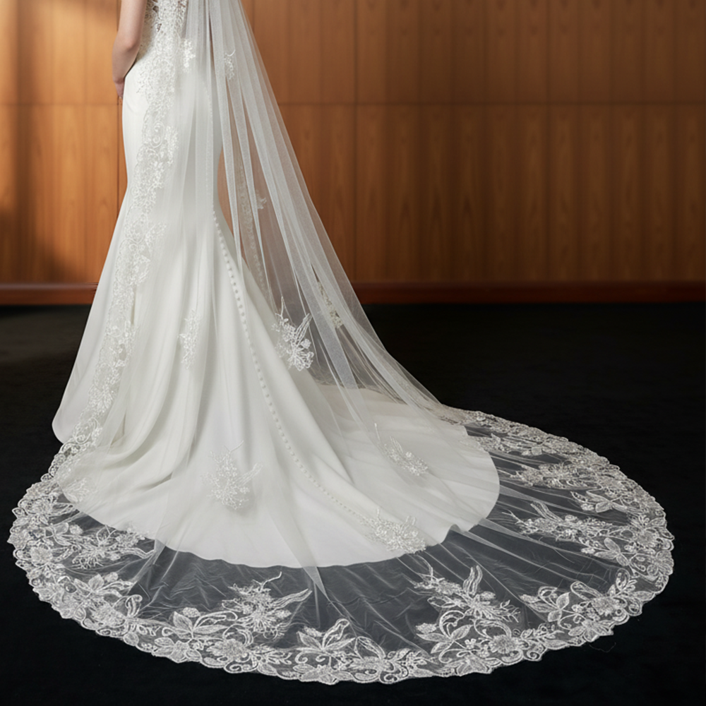 Close-up of enchanted garden lace cathedral wedding veil, detailed floral lace train