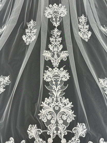 Close-up of ascending floral lace embroidery on Celestial Bloom cathedral tulle veil, intricate bridal detail