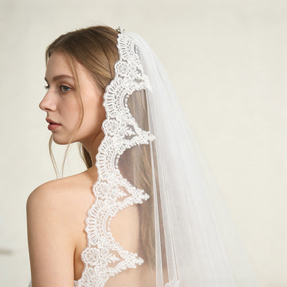 Lunar Ray cathedral tulle veil, side view of radiating lace bridal veil in studio portrait
