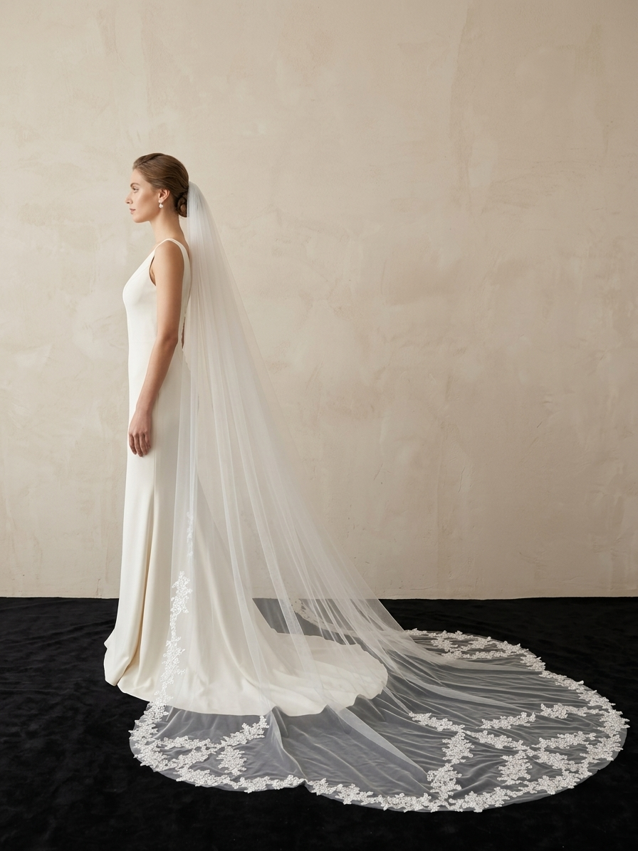 Bride wearing non-traditional irregular lace cathedral wedding veil