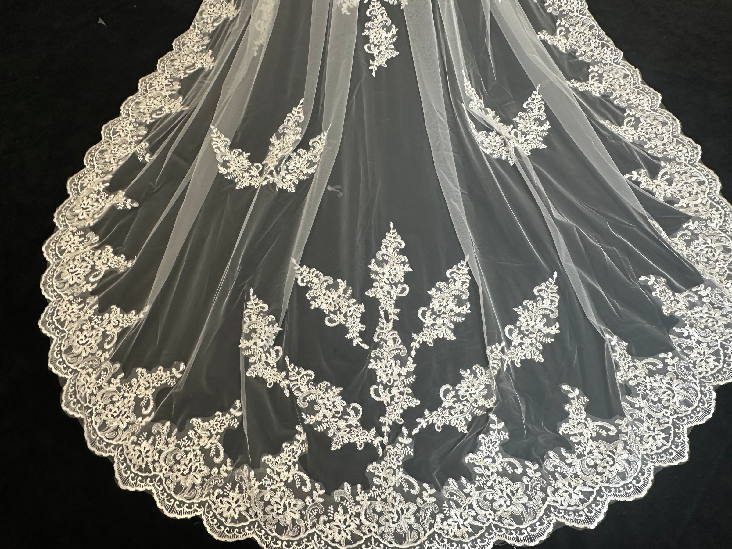 Close-up of forest canopy lace cathedral veil, intricate tree-inspired embroidery detail